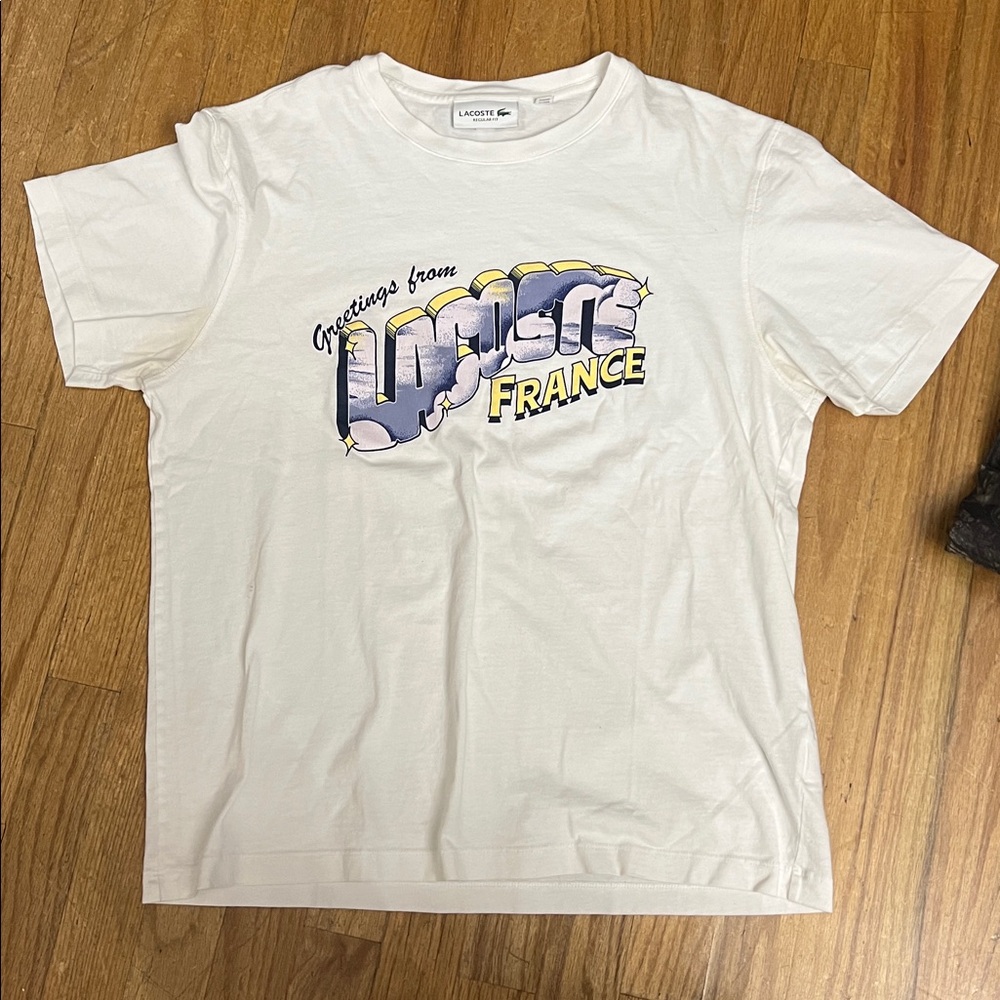 size large lacoste graphic tee “greetings from lacoste france”